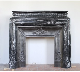 Original Louis XIV "Boudin Haut" fireplace mantel carved in Black Marquinia marble.