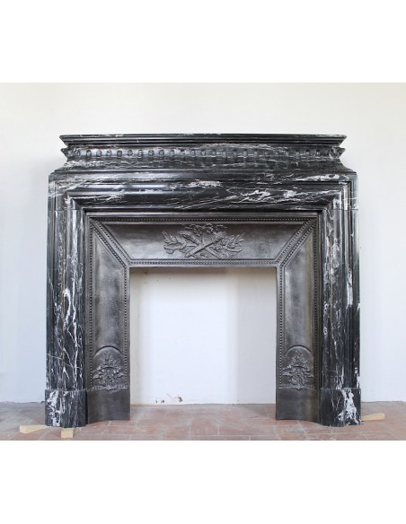 Original Louis XIV "Boudin Haut" fireplace mantel carved in Black Marquinia marble.