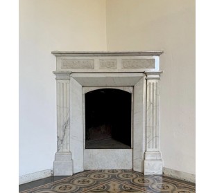 Art Nouveau period marble fireplace carved in Carrara marble. This antique mantel can be mounted at an angle.