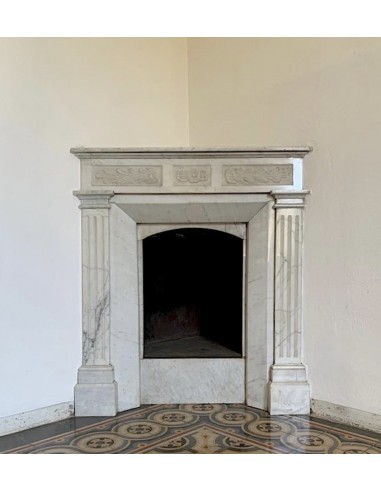 Art Nouveau period marble fireplace carved in Carrara marble. This antique mantel can be mounted at an angle.