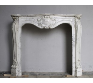 Art Nouveau-style fireplace mantel carved out of an amazing veined Calacatta White marble.