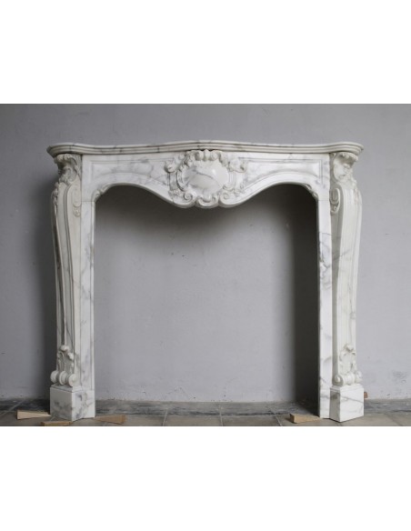 Art Nouveau-style fireplace mantel carved out of an amazing veined Calacatta White marble.