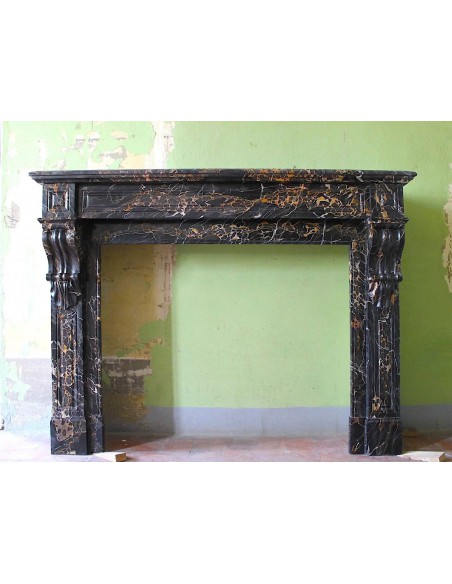 Antique Louis Philippe "Palmettes" mantel carved in rare black Portoro marble