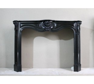 Antique original Louis XV "Trois Coquilles" in black marble with sculptures of shells on the frieze and on the sides.