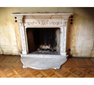 Antique white marble fireplace of Italian origin and design, more specifically Lombard, and 18th-century period.