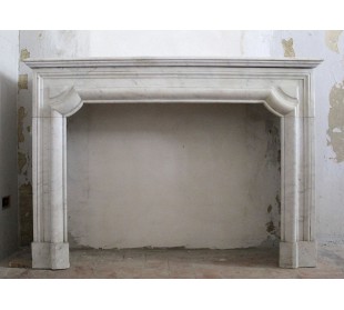 Antique "Boudin" fireplace in white Carrara marble. This fire surround has modern and elegant shapes.