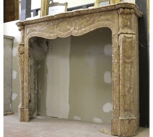 Antique Louis XV "Pied Galbé" fire surround carved in Yellow marble.