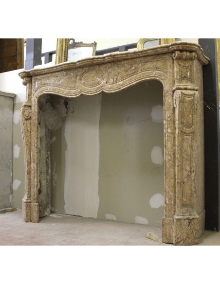 Antique Louis XV "Pied Galbé" fire surround carved in Yellow marble.