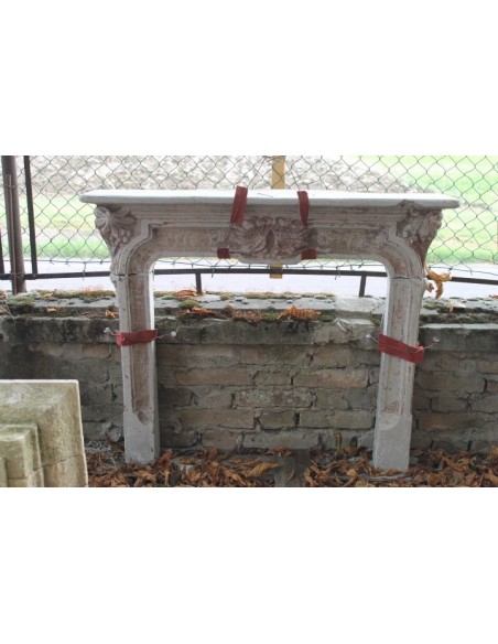 Antique Art Nouveau-style fireplace mantel, Milanese, made of cement grit, with decorative floral elements.