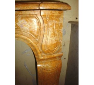 Art Nouveau style fireplace surround carved in yellow "Giallo Reale" marble. 2
