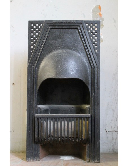 A small Art Deco cast iron fireplace that is a true design object signed GENTIL & BOURDET.