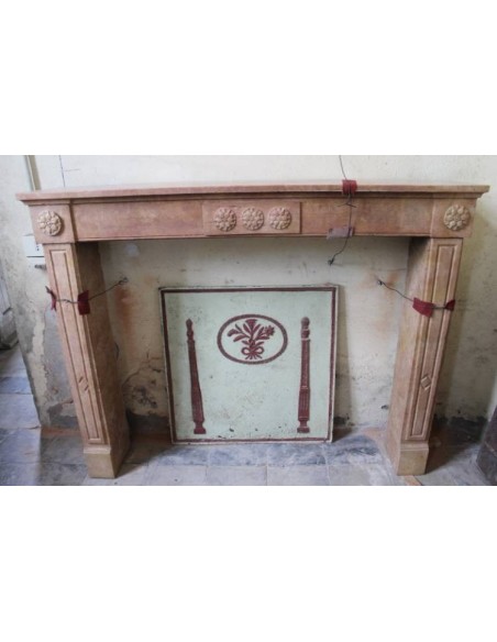 Antique Neoclassical fireplace mantel carved in "Pretty” stone with sunflower floral carvings.