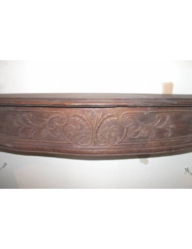 Antique fireplace mantel carved out of oak. This fireplace is an alternative to marble and stone fireplaces.