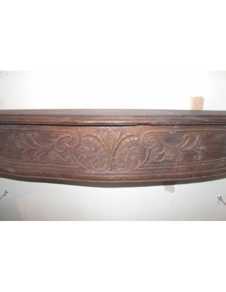Antique fireplace mantel carved out of oak. This fireplace is an alternative to marble and stone fireplaces.