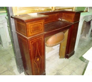 Antique Art Deco fireplace mantel coming from England. This antique English fire surround is carved in Mahogany wood.