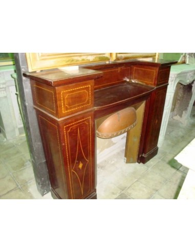 Antique Art Deco fireplace mantel coming from England. This antique English fire surround is carved in Mahogany wood.