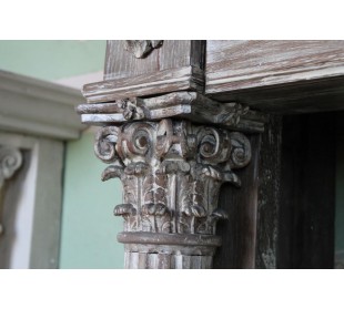 Antique oak fireplace mantel with neoclassical architectural details and column decoration. 2