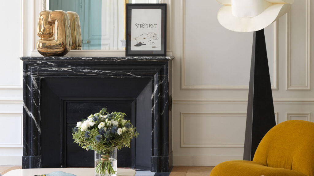 Restoration of an antique Louis XIV black marble fireplace by Artis craftsmen